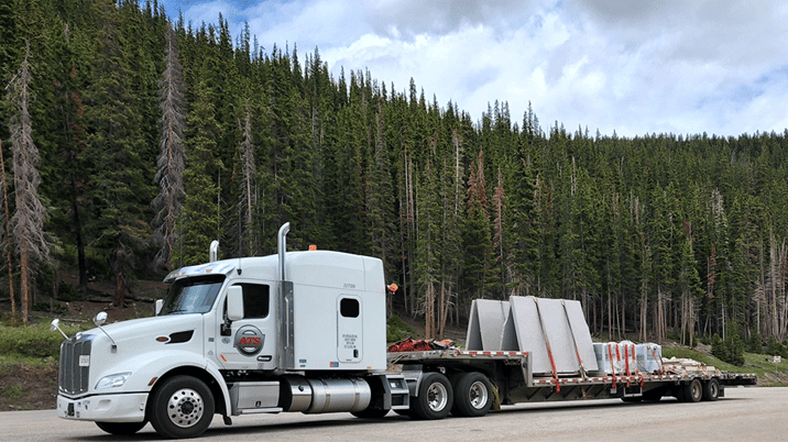 Step-deck-shipment-with-plastic-wrapping